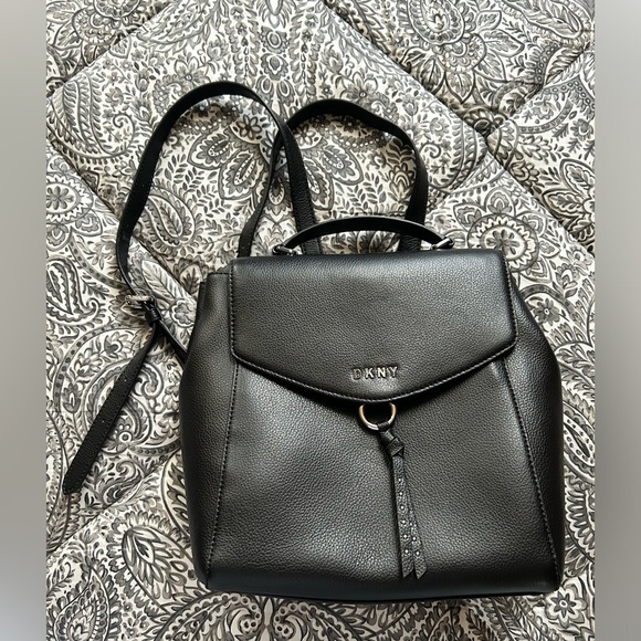 dkny lola leather backpack black Antoinette There is an external zipped pocket with a bold white logo on the front for instant designer impact DKNY Sutton Textured Leather Medium